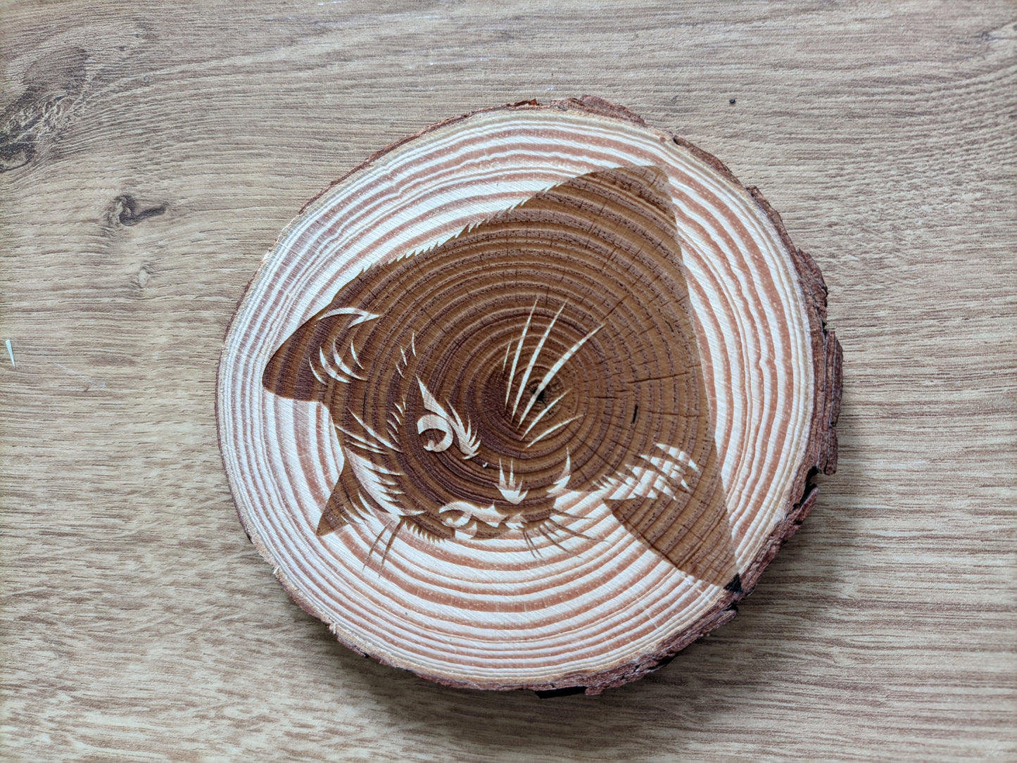 Natural wood coasters with artistic engravings