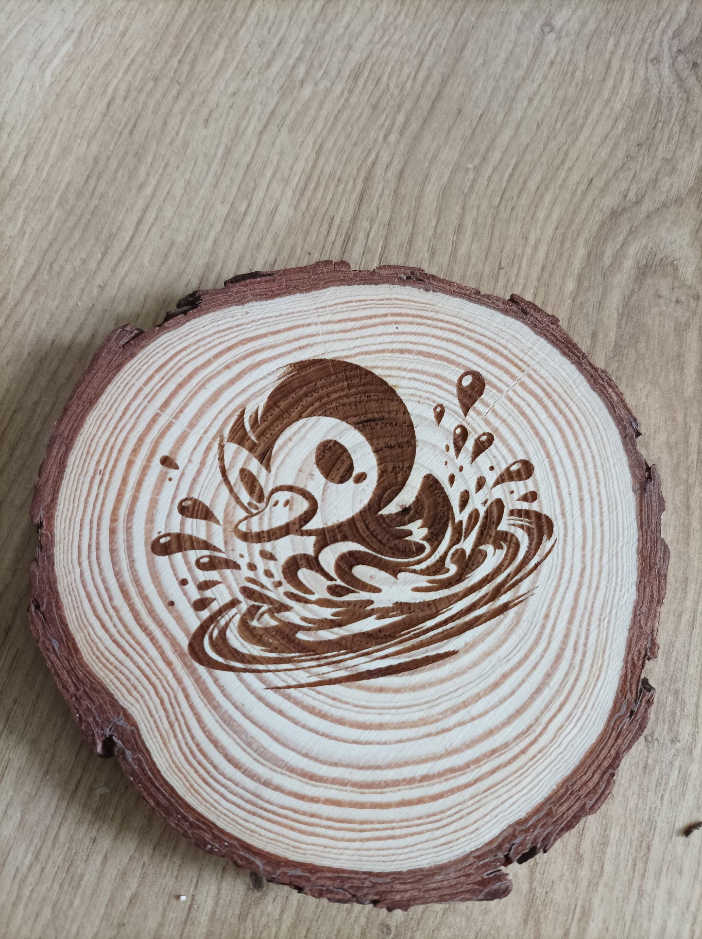 Natural wood coasters with artistic engravings