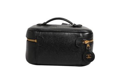 Schwarze und goldene Kosmetiktasche