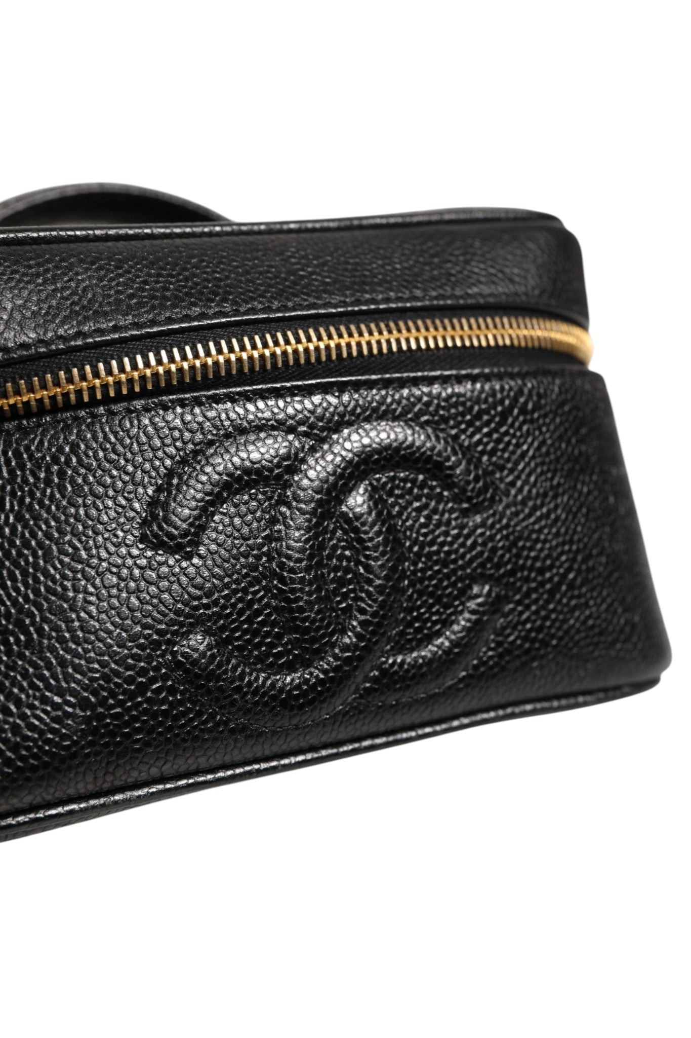 Schwarze und goldene Kosmetiktasche