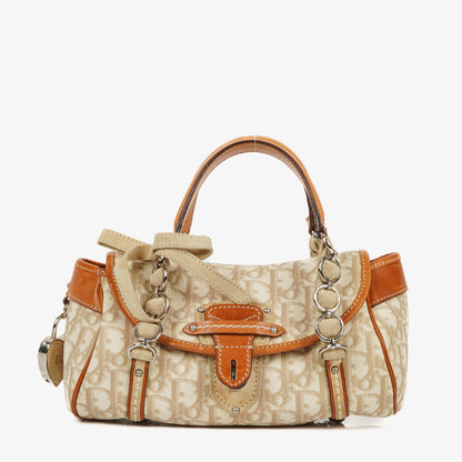 Christian Dior Romantique Trotter Monogramm Tasche aus beschichtetem Canvas in Tan