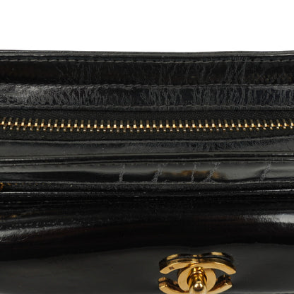 Chanel CC Handgelenktasche aus schwarzem Lackleder mit 24K Goldbeschlägen
