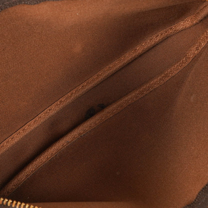 Louis Vuitton Pochette Accessoires Clutch aus Monogram Canvas
