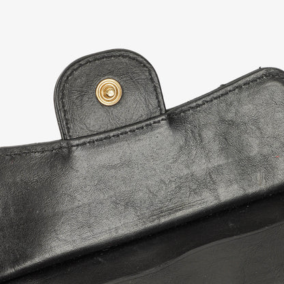 Chanel Münzgeldbörse aus schwarzem gestepptem Leder