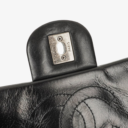 CHANEL Single Flap Bag aus schwarzem gestepptem Leder