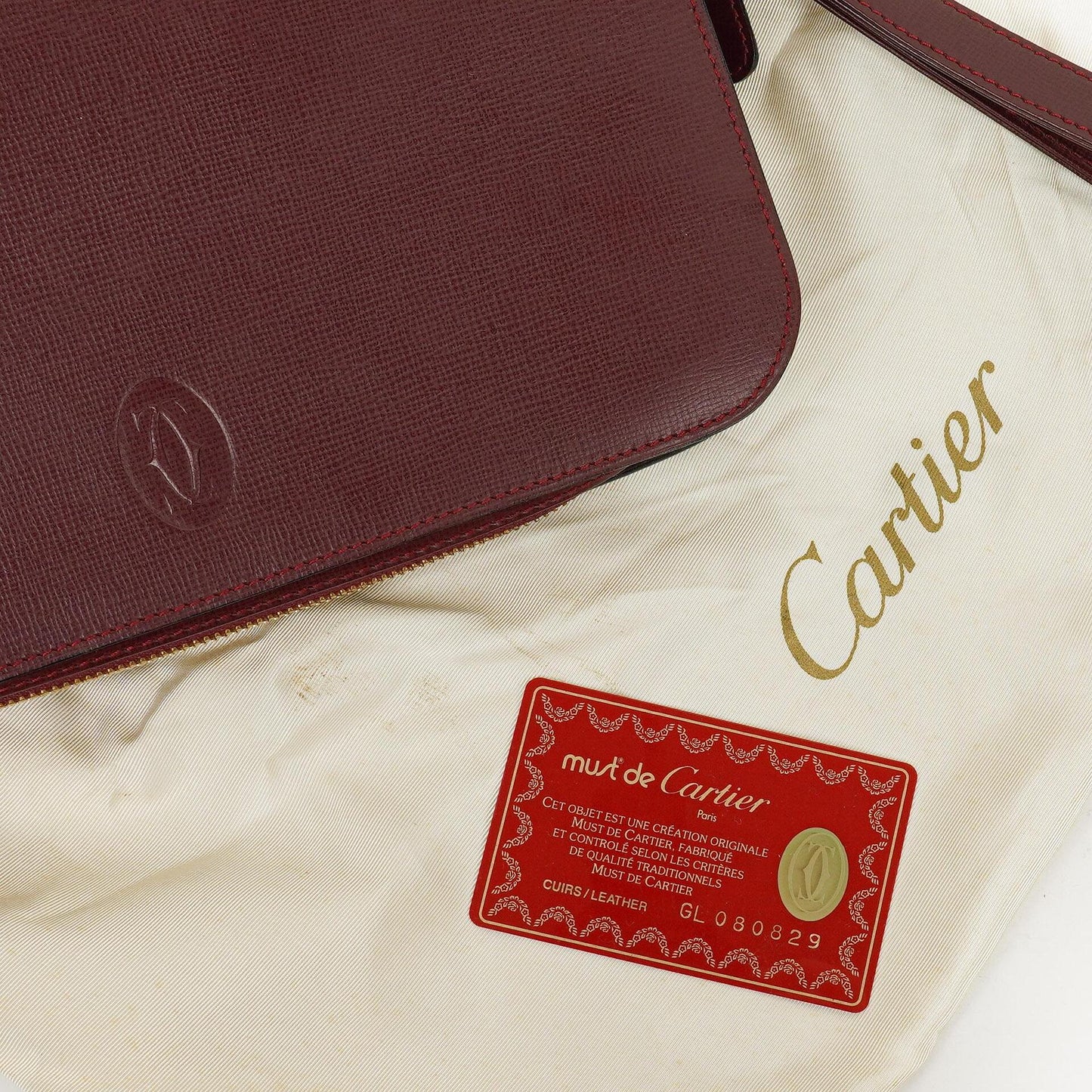 Cartier Must de Cartier Clutch aus burgunderrotem Leder
