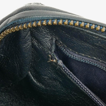 CHANEL Mini Barrel Quasten-Tasche aus schwarzem gestepptem Lammleder