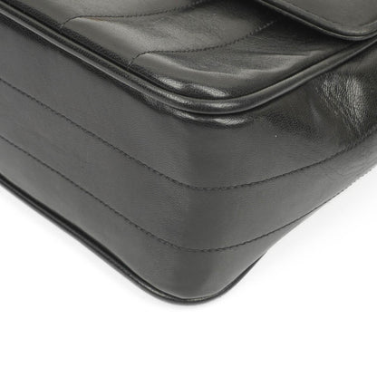Chanel Kelly Flap Tasche aus schwarzem vertikal gestepptem Lammleder