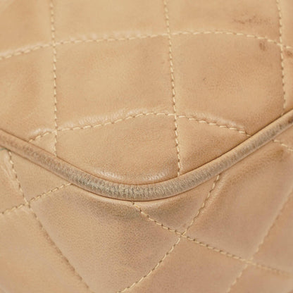 Chanel Camera Tasche aus beigem gestepptem Lammleder mit Quaste und CC