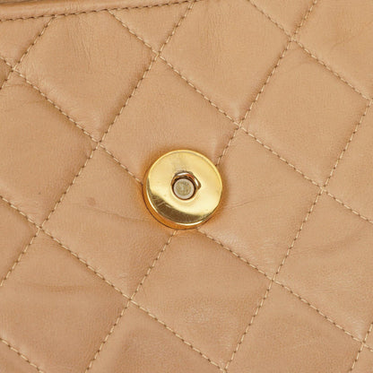 Chanel Camera Tasche aus beigem gestepptem Lammleder mit Quaste und CC