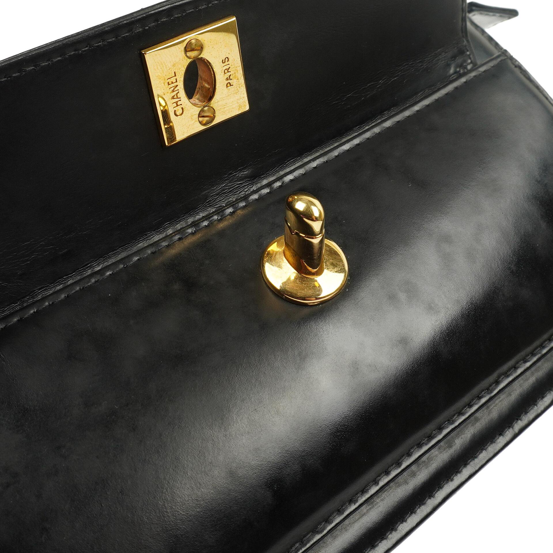 Chanel CC Schwarze Leder Clutch 24K Goldbeschläge, 1996-1997