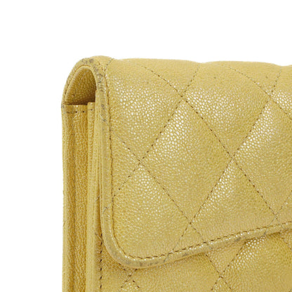 Chanel Classic Flap Geldbörse Petite Maroquinerie aus metallic-gelbem gestepptem Caviar-Leder