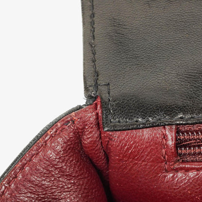 CHANEL Klappentasche aus schwarzem gestepptem Lammleder mit Ketten-Obergriff und 24K vergoldeten Beschlägen