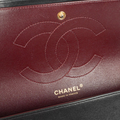 Chanel Jumbo Classic Double Flap Tasche aus schwarzem gestepptem Lammleder mit goldfarbener Hardware