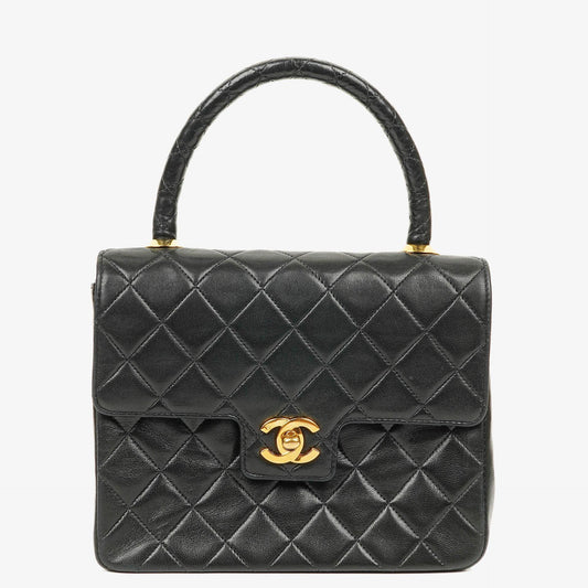 Chanel Mini Classic Kelly Vintage aus schwarzem gestepptem Lammleder mit 24K vergoldeten Beschlägen