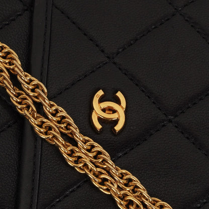 Chanel Mini Klapptasche Schwarze gesteppte Lammleder mit 24K vergoldeten Beschlägen Gut