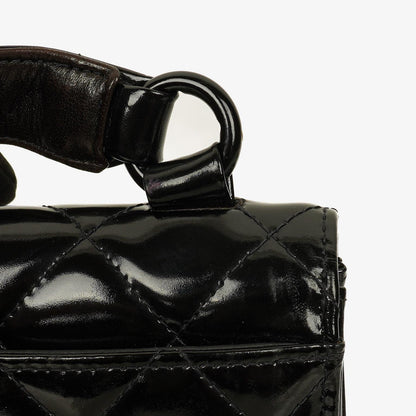 Chanel Small Single Flap Bag aus schwarzem gestepptem Lackleder