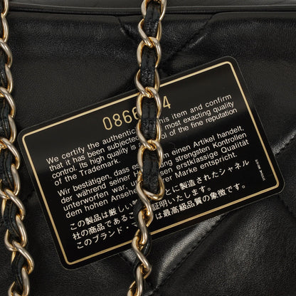 Chanel Vintage Camera Tasche mit Quaste CC aus schwarzem gestepptem Leder