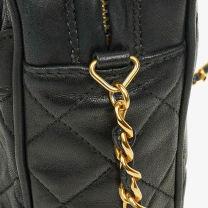 CHANEL Vintage CC Kamera-Quasten-Tasche aus schwarzem gestepptem Lammleder