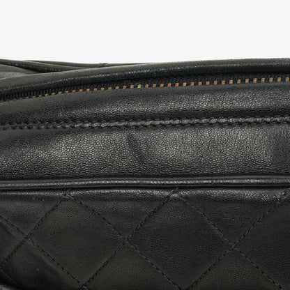 CHANEL Vintage CC Kamera-Quasten-Tasche aus schwarzem gestepptem Lammleder