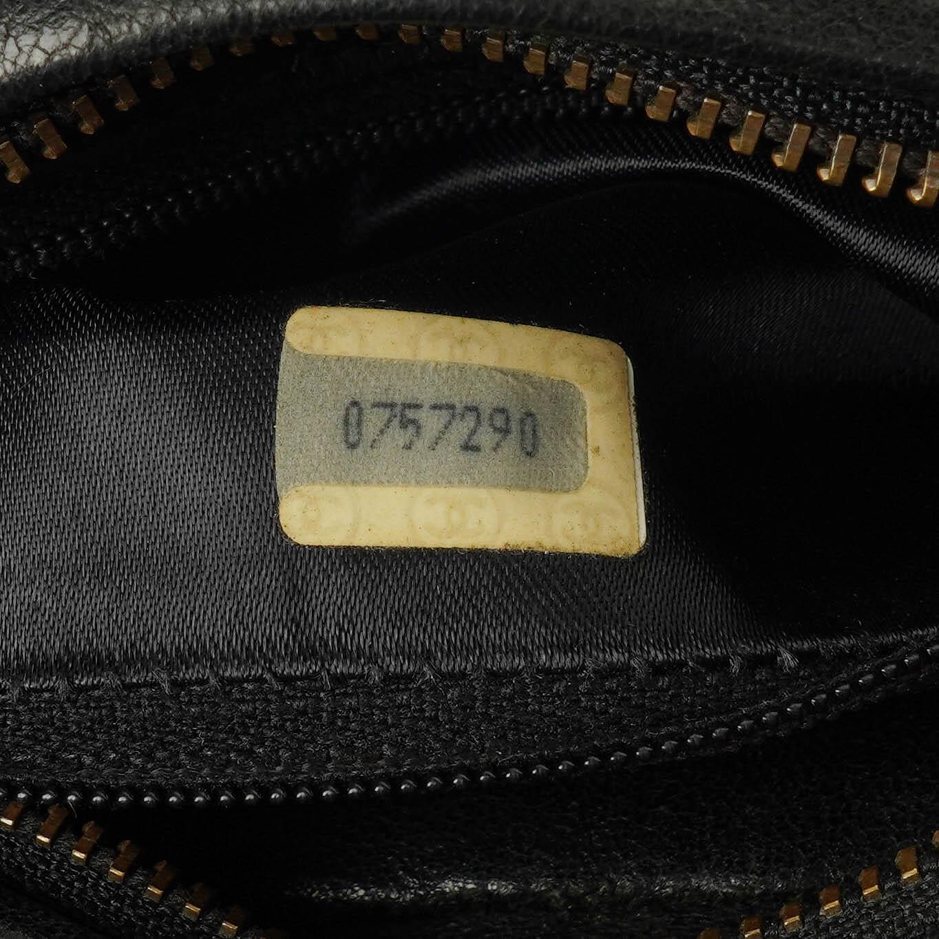 Chanel Vintage CC Camera Bag aus schwarzem gestepptem Lammleder mit Quaste