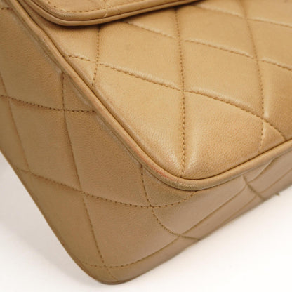 Chanel Vintage Mittlere Kamera Quaste CC Frontklappen Tasche aus beigem gestepptem Lammleder