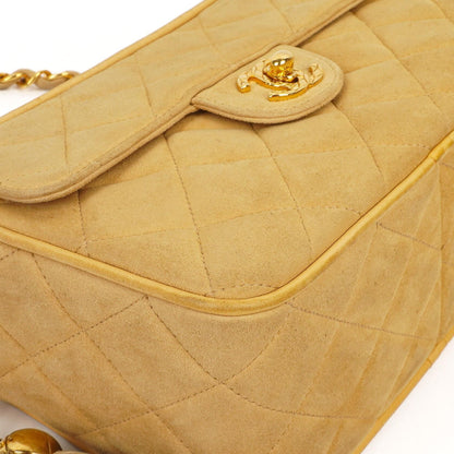 Chanel Vintage Small Camera Tassel Bag aus goldfarbenem gestepptem Wildleder mit CC Logo Fronttasche