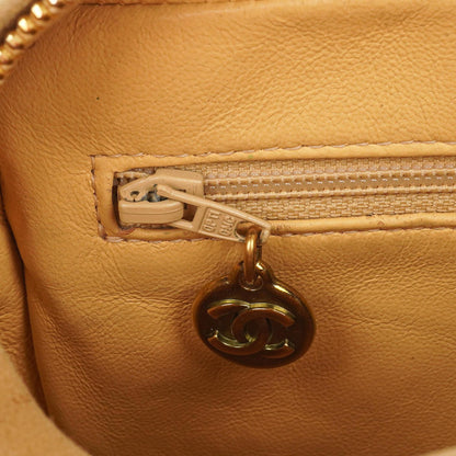 Chanel Vintage Small Camera Tassel Bag aus goldfarbenem gestepptem Wildleder mit CC Logo Fronttasche