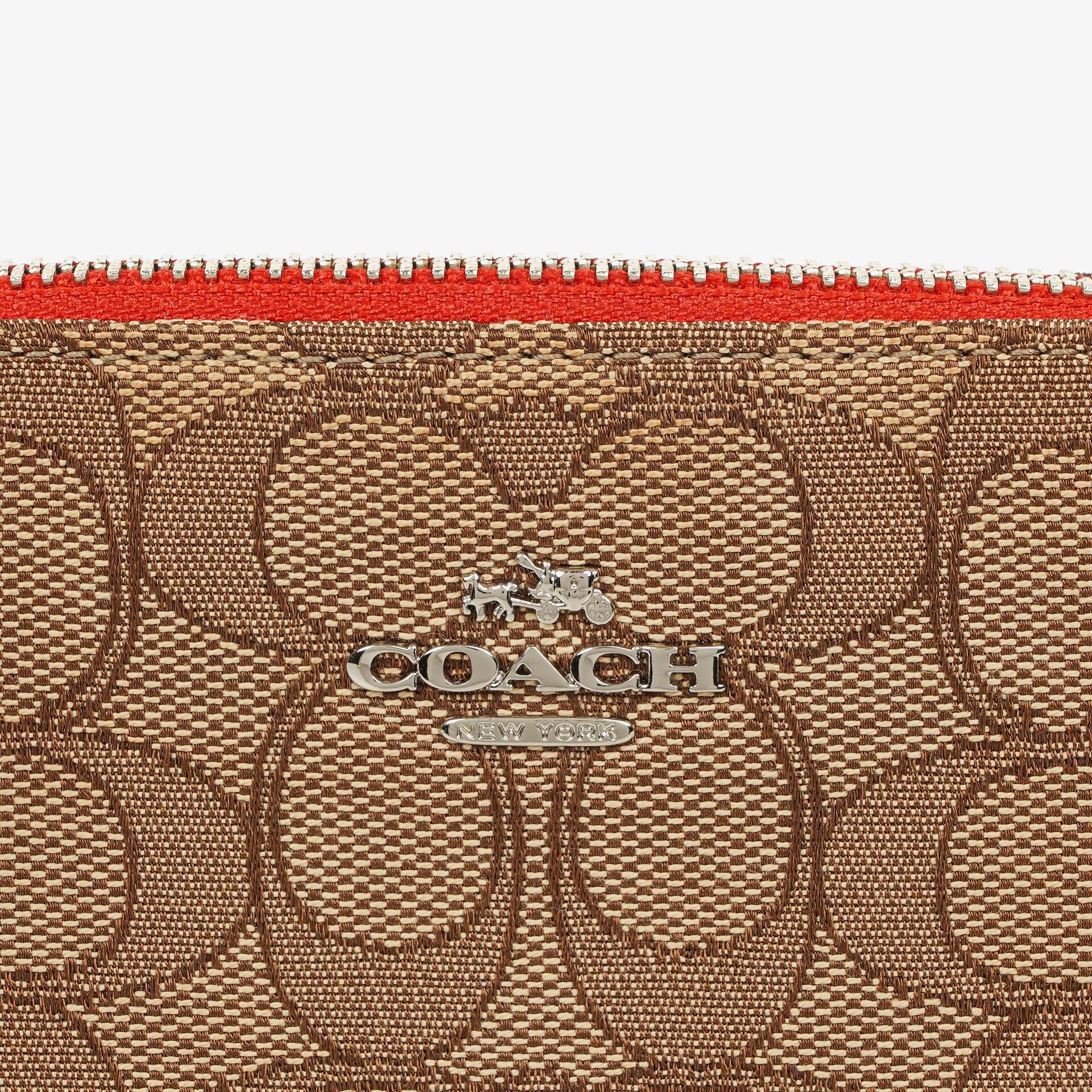 Coach Nolita 15 Mini Tasche aus Signature Canvas