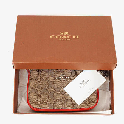 Coach Nolita 15 Mini Tasche aus Signature Canvas