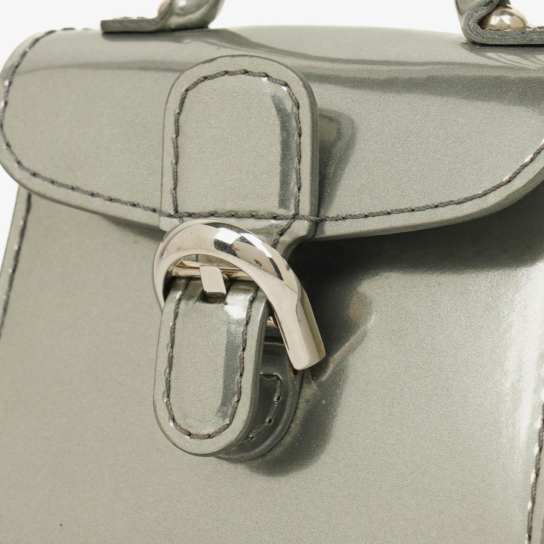 Delvaux Brillant Super Mini Charm Tasche aus Vernis