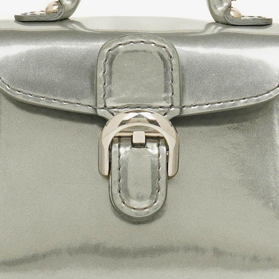 Delvaux Brillant Super Mini Charm Tasche aus Vernis