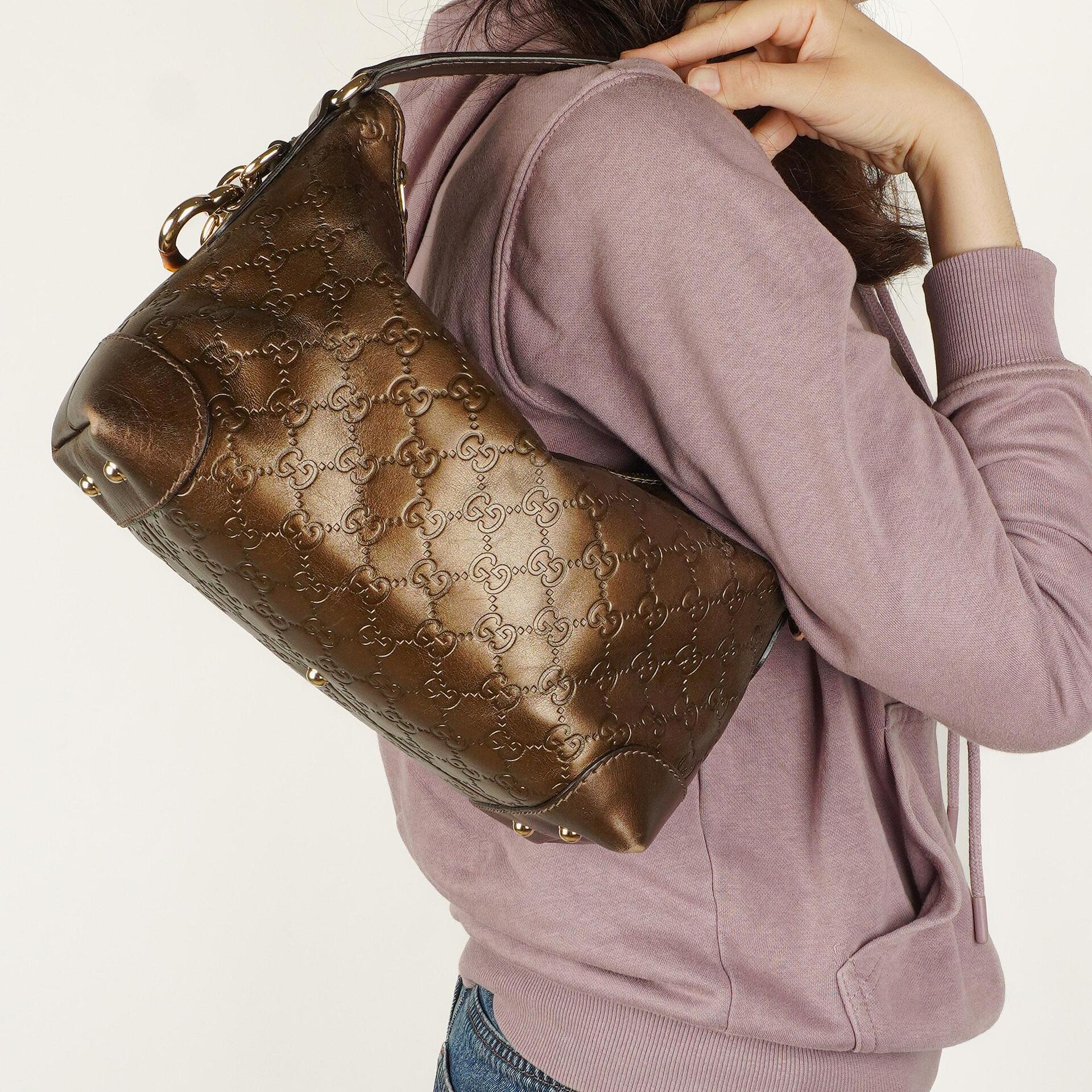 Gucci Heart Bit Hobo-Tasche aus bronzefarbenem Metallic Guccissima Leder