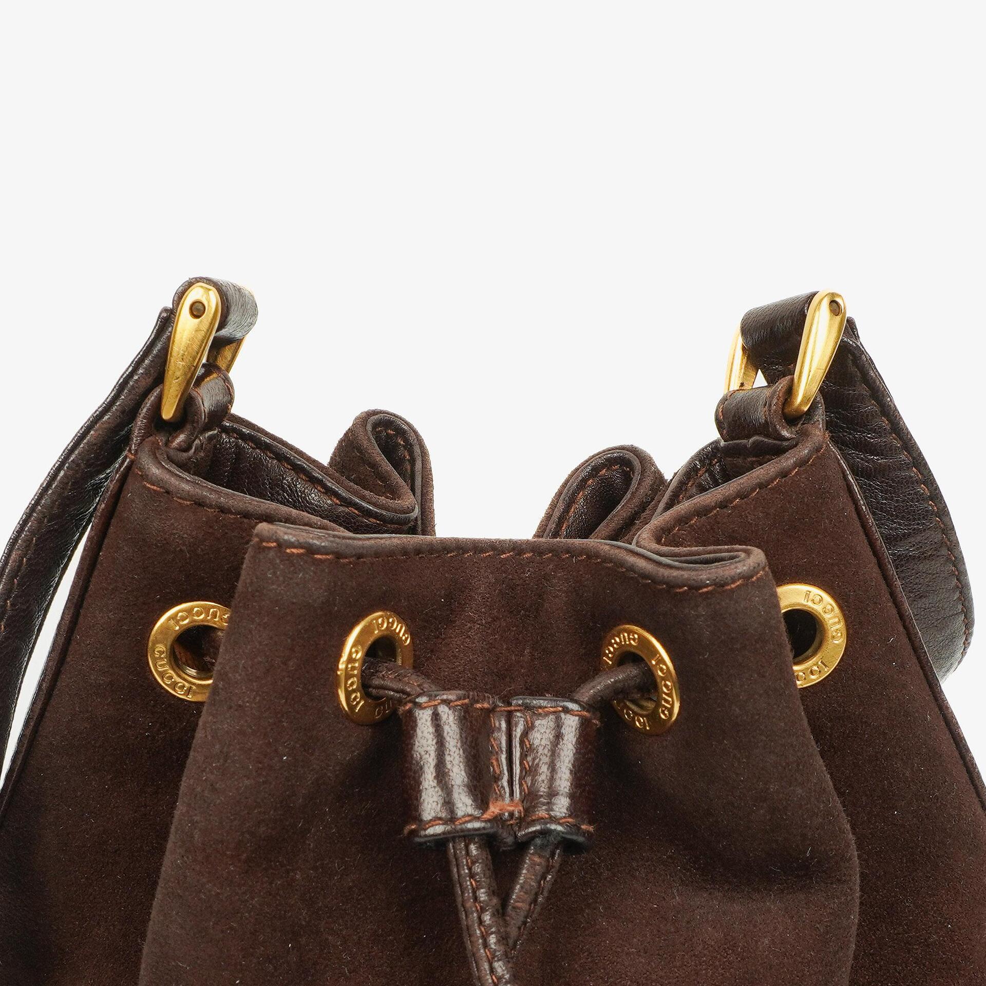 Gucci Bucket Bag aus braunem Leder und Wildleder mit Horsebit-Kette und Zugband