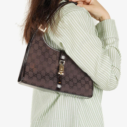 Gucci Jackie Schultertasche aus lila GG Canvas