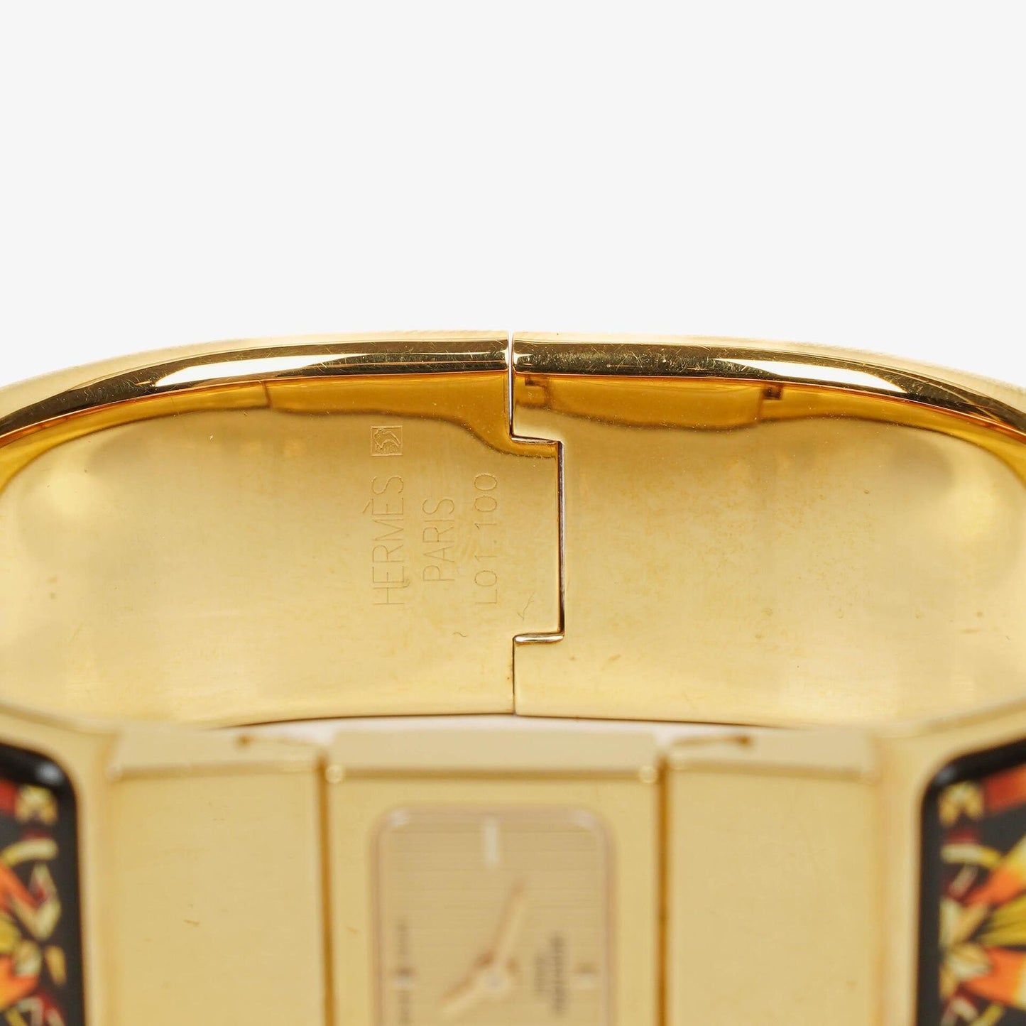 Hermès Loquet L01.201 Armreif-Quarzuhr aus schwarzer Reitsport-Emaille und vergoldetem Metall