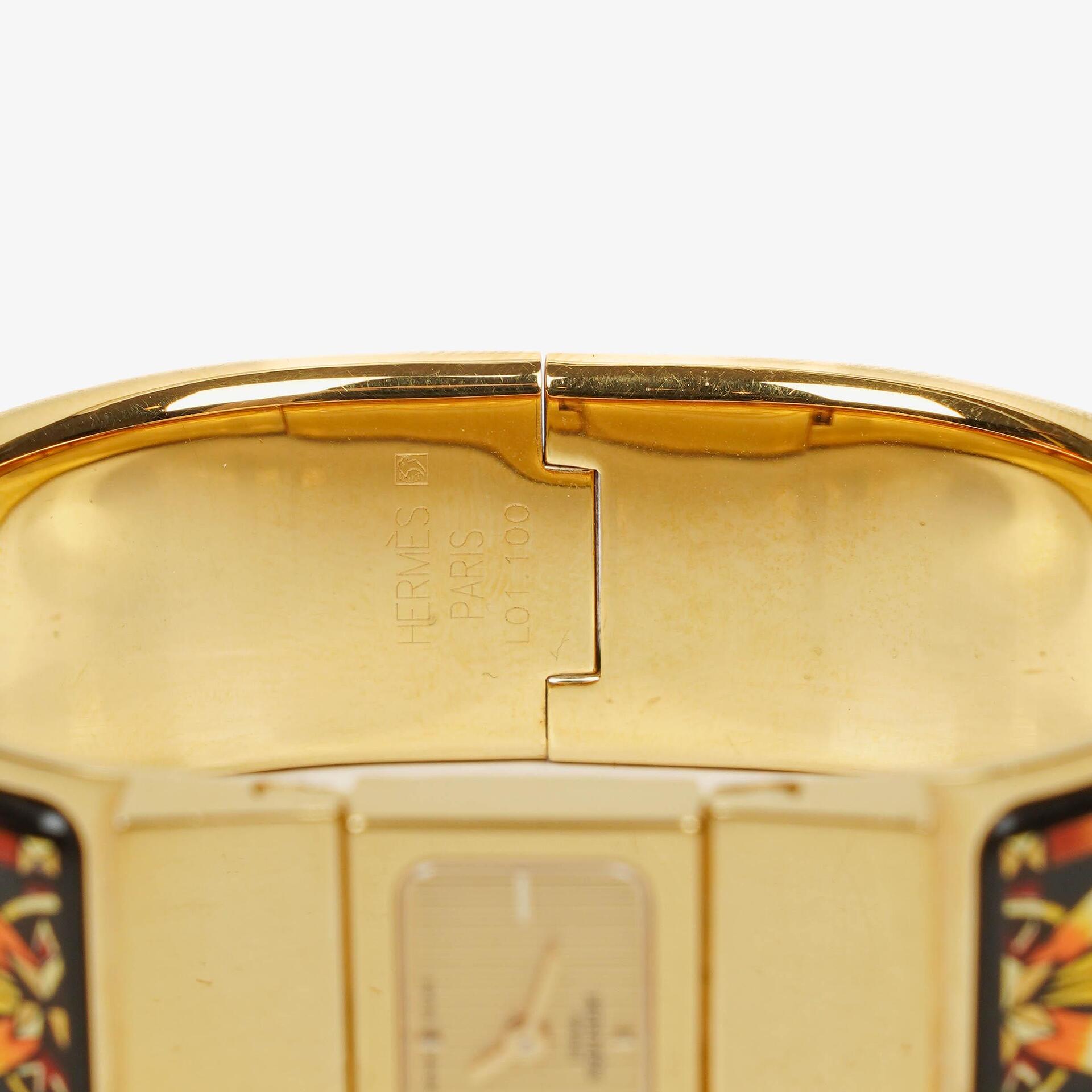 Hermès Loquet L01.201 Armreif-Quarzuhr aus schwarzer Reitsport-Emaille und vergoldetem Metall
