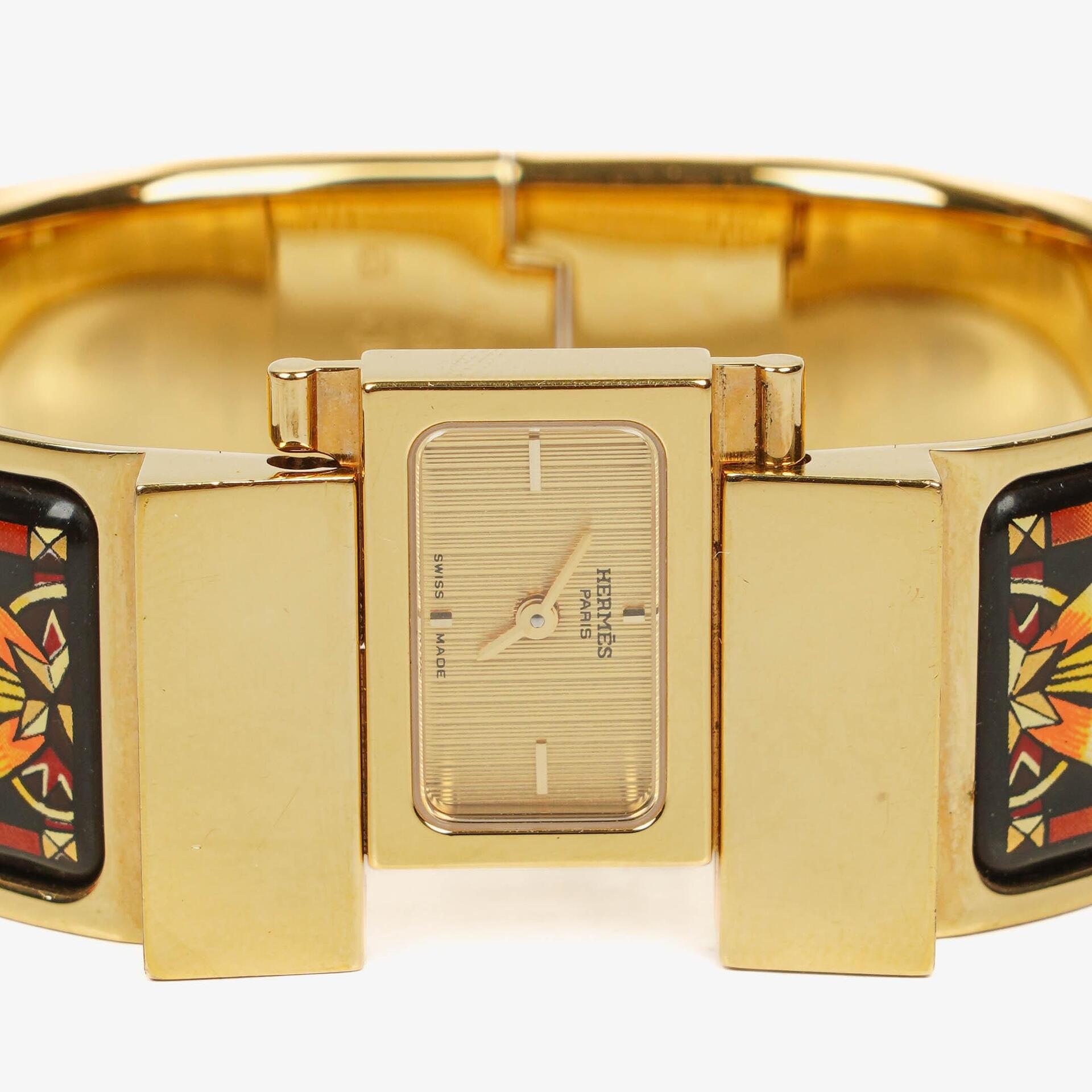 Hermès Loquet L01.201 Armreif-Quarzuhr aus schwarzer Reitsport-Emaille und vergoldetem Metall