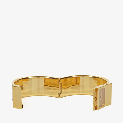 Hermès Loquet L01.201 Armreif-Quarzuhr aus schwarzer Reitsport-Emaille und vergoldetem Metall