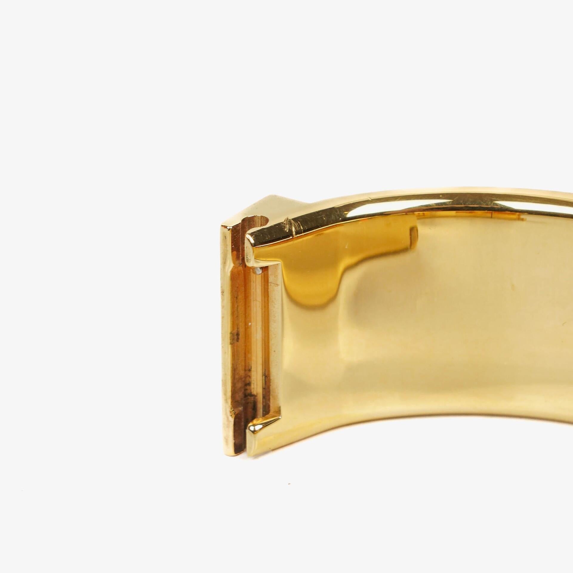 Hermès Loquet L01.201 Armreif-Quarzuhr aus schwarzer Reitsport-Emaille und vergoldetem Metall