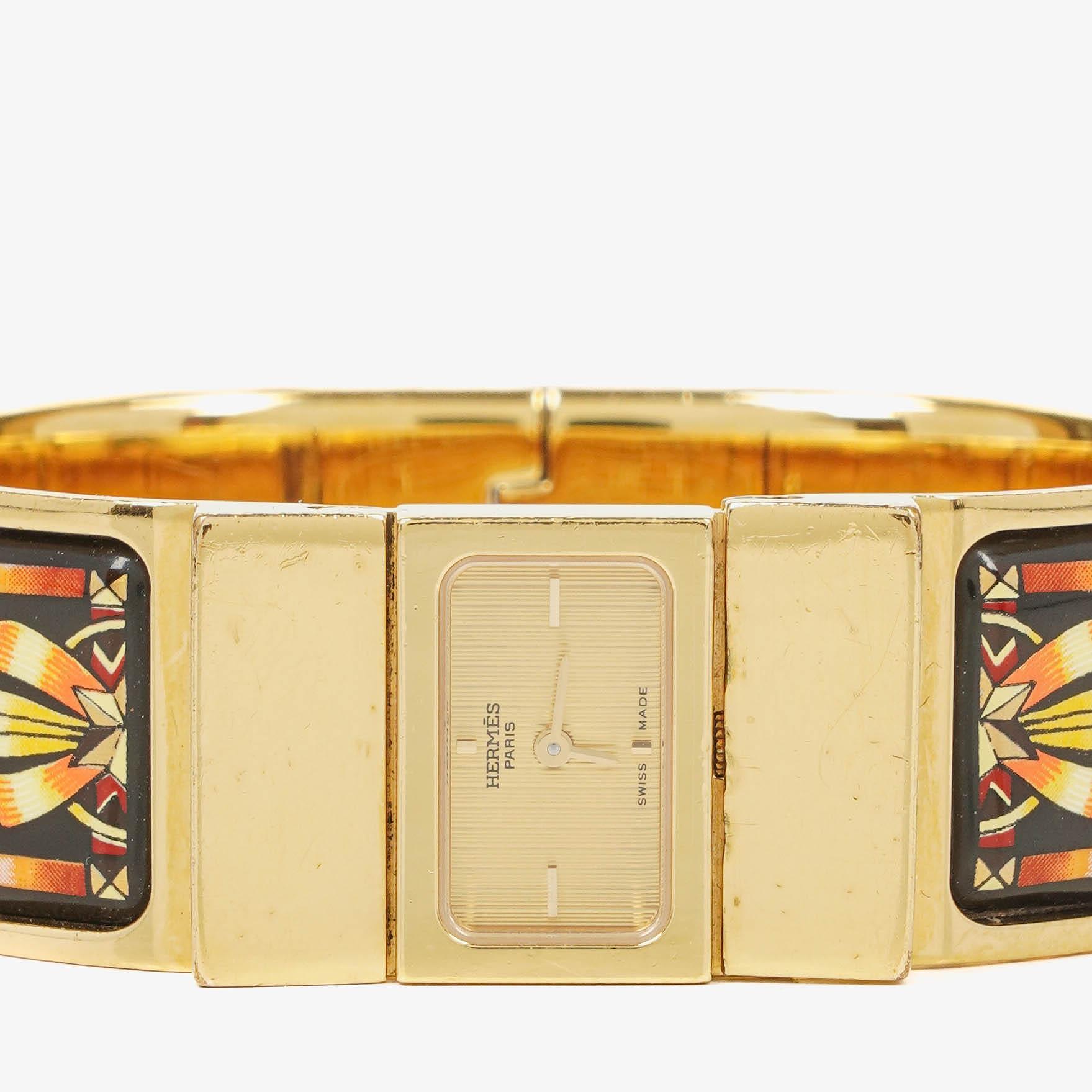Hermès Loquet L01.201 Armreif-Quarzuhr aus schwarzem Reitsport-Emaille und vergoldetem Metall