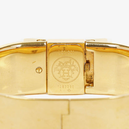 Hermès Loquet L01.201 Armreif-Quarzuhr aus schwarzem Reitsport-Emaille und vergoldetem Metall