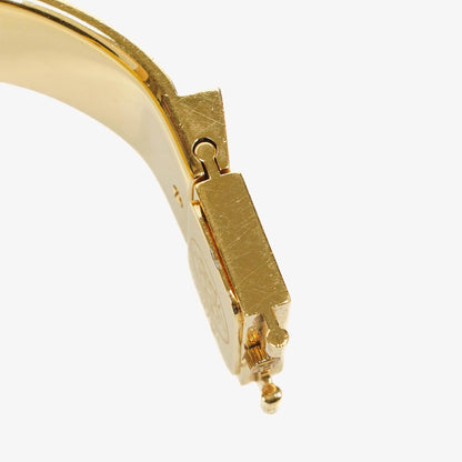 Hermès Loquet L01.201 Armreif-Quarzuhr aus schwarzem Reitsport-Emaille und vergoldetem Metall