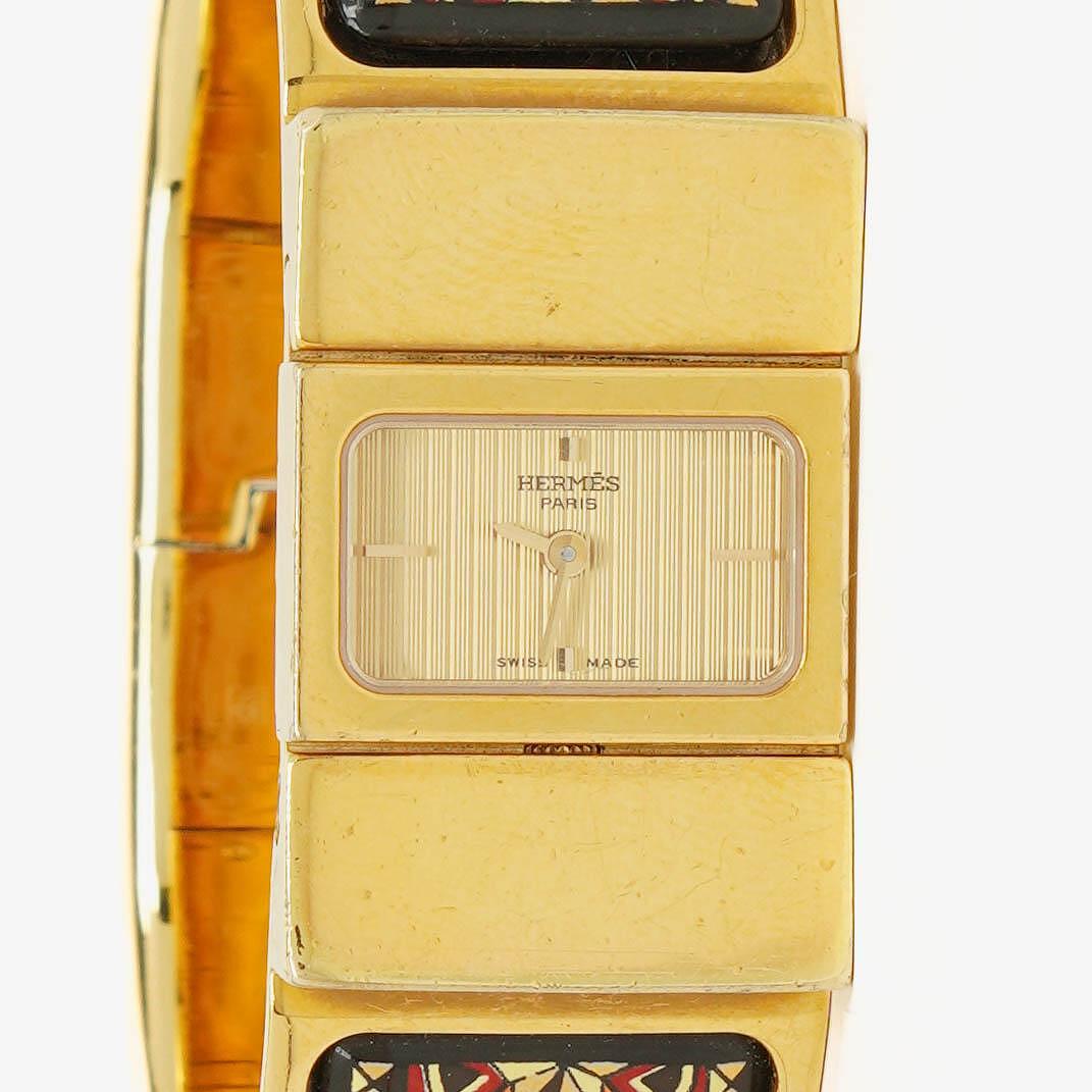 Hermès Loquet L01.201 Armreif-Quarzuhr mit schwarzem Equestrian-Emaille und Vergoldung