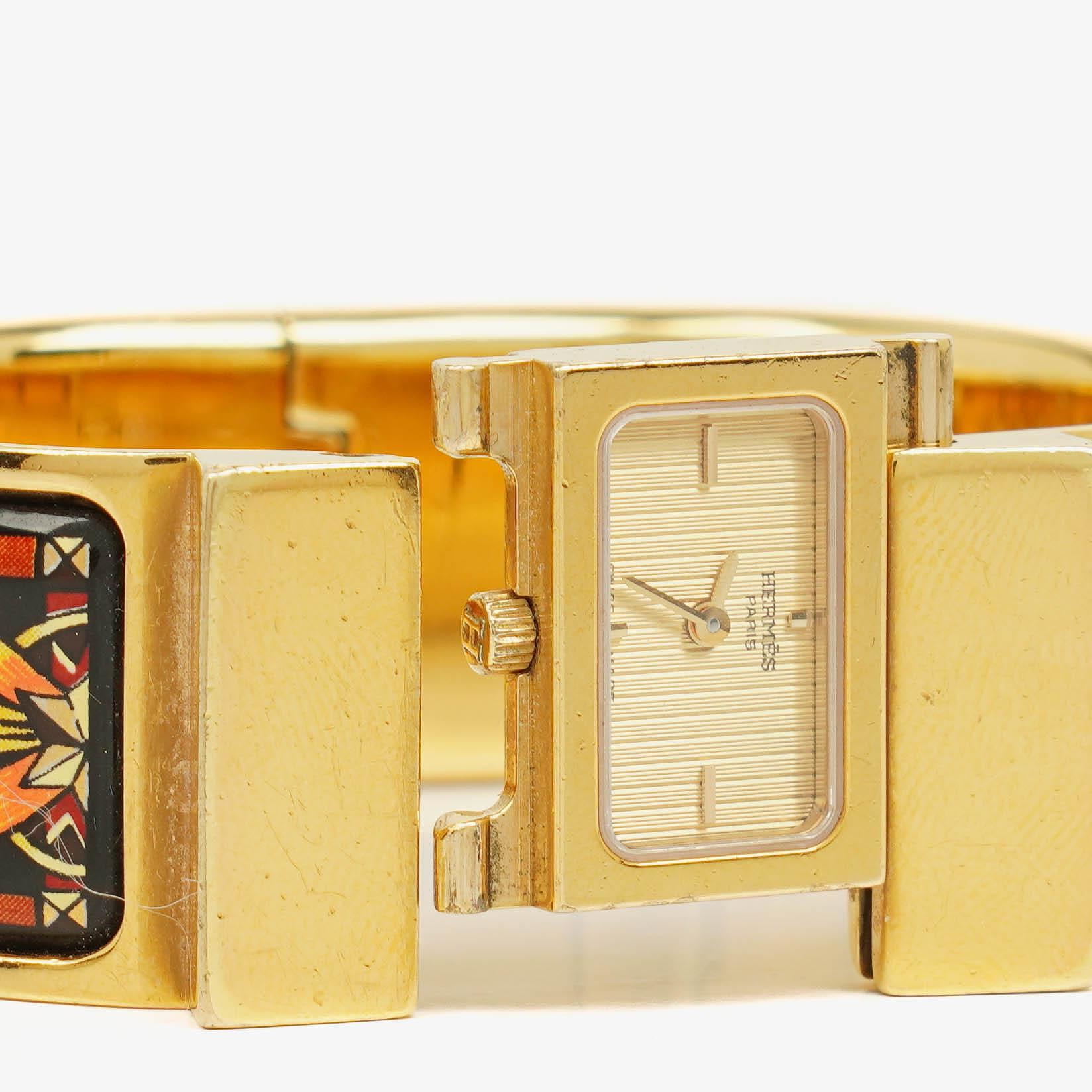 Hermès Loquet L01.201 Armreif-Quarzuhr mit schwarzem Equestrian-Emaille und Vergoldung