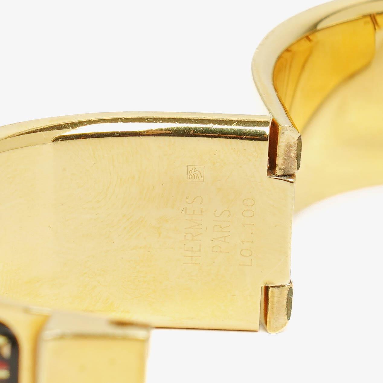 Hermès Loquet L01.201 Armreif-Quarzuhr mit schwarzem Equestrian-Emaille und Vergoldung