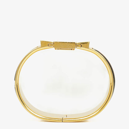 Hermès Loquet L01.201 Armreif-Quarzuhr mit schwarzem Equestrian-Emaille und Vergoldung