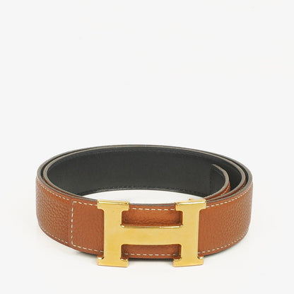 Hermès H Wendegürtel 85 aus Box- und Togo-Leder in Schwarz/Gold, 30 mm