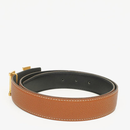 Hermès H Wendegürtel 85 aus Box- und Togo-Leder in Schwarz/Gold, 30 mm