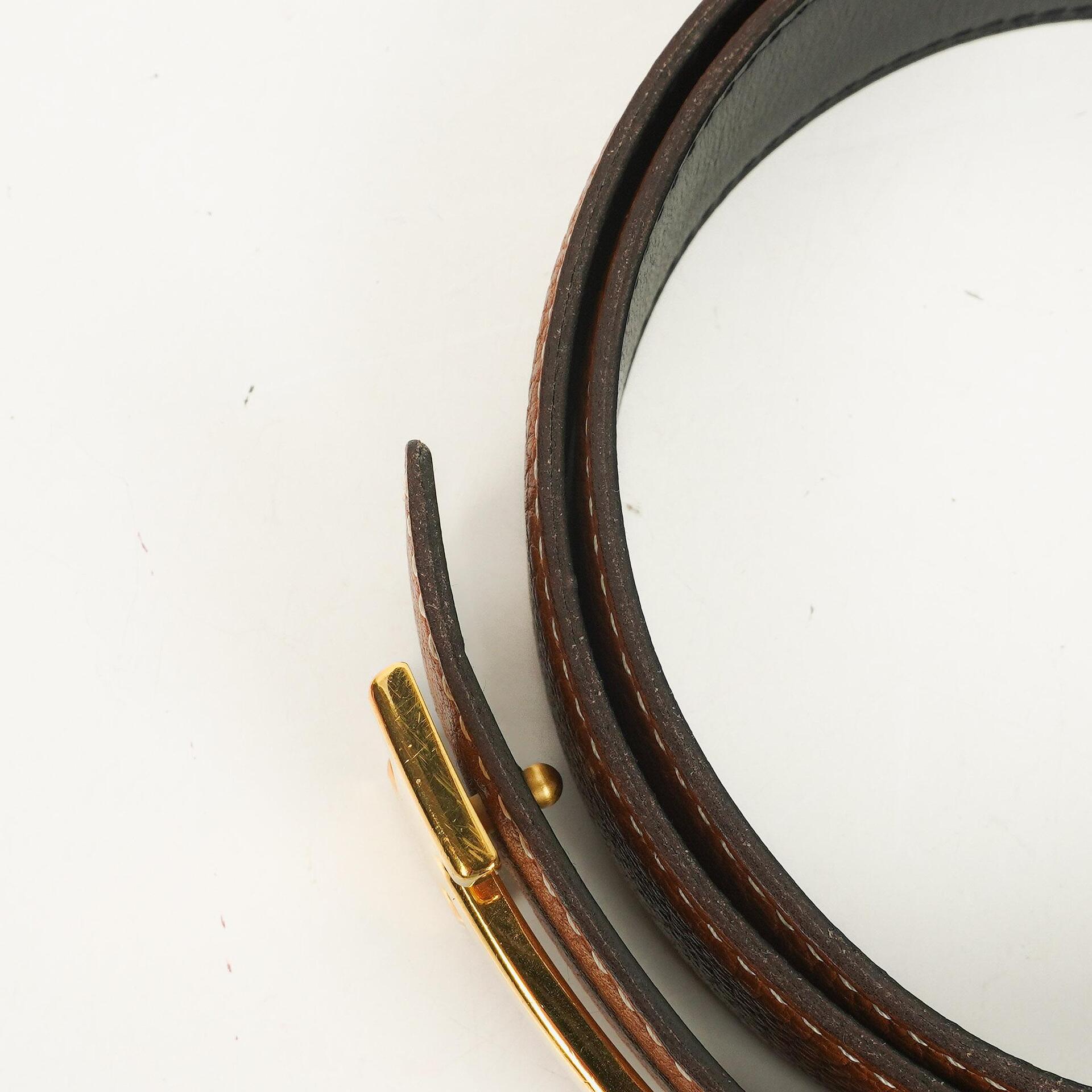 Hermès H Wendegürtel 85 aus Box- und Togo-Leder in Schwarz/Gold, 30 mm
